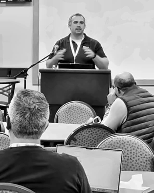Brad speaking from the stage at CITN 2026.